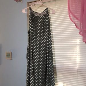 Green.sleeveless dress with white polka dots